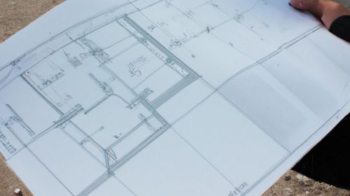 Person holding a house blueprint